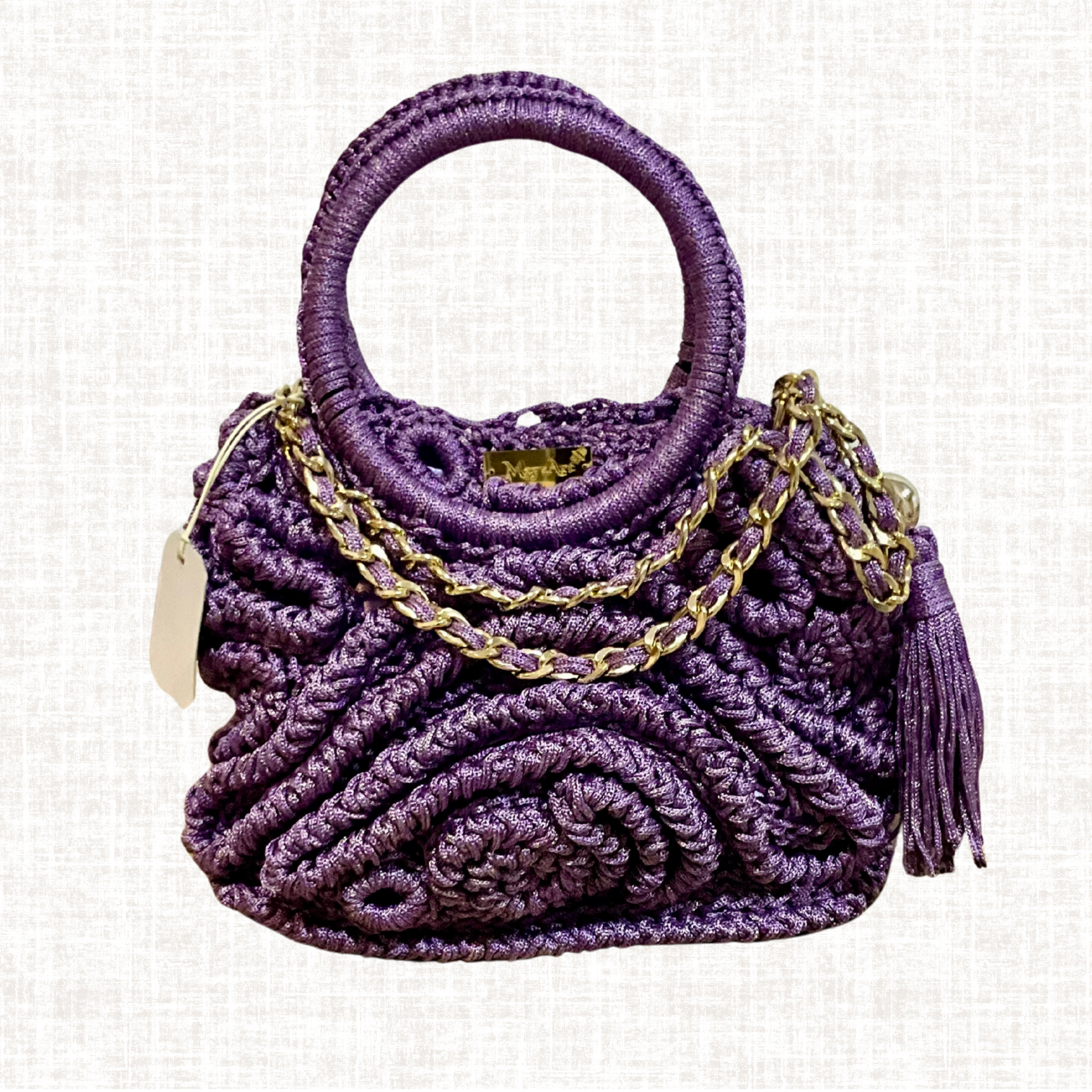 Handcrafted purple crochet artisan handbag with gold chain from North Africa